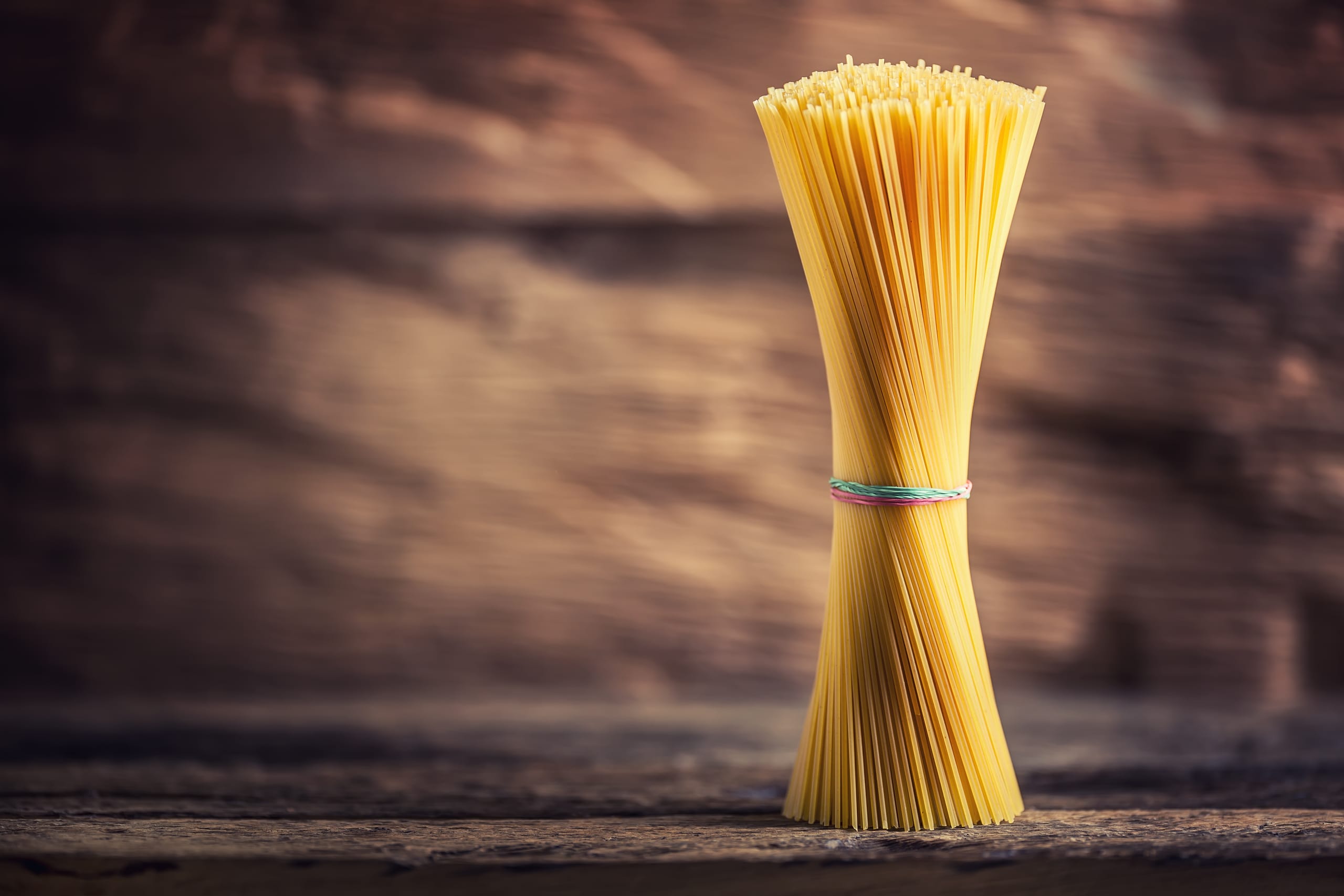 Spaghetti. Pasta spaghetti on rustic wooden background.