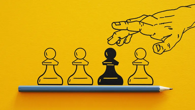 Hand mit Spielfiguten