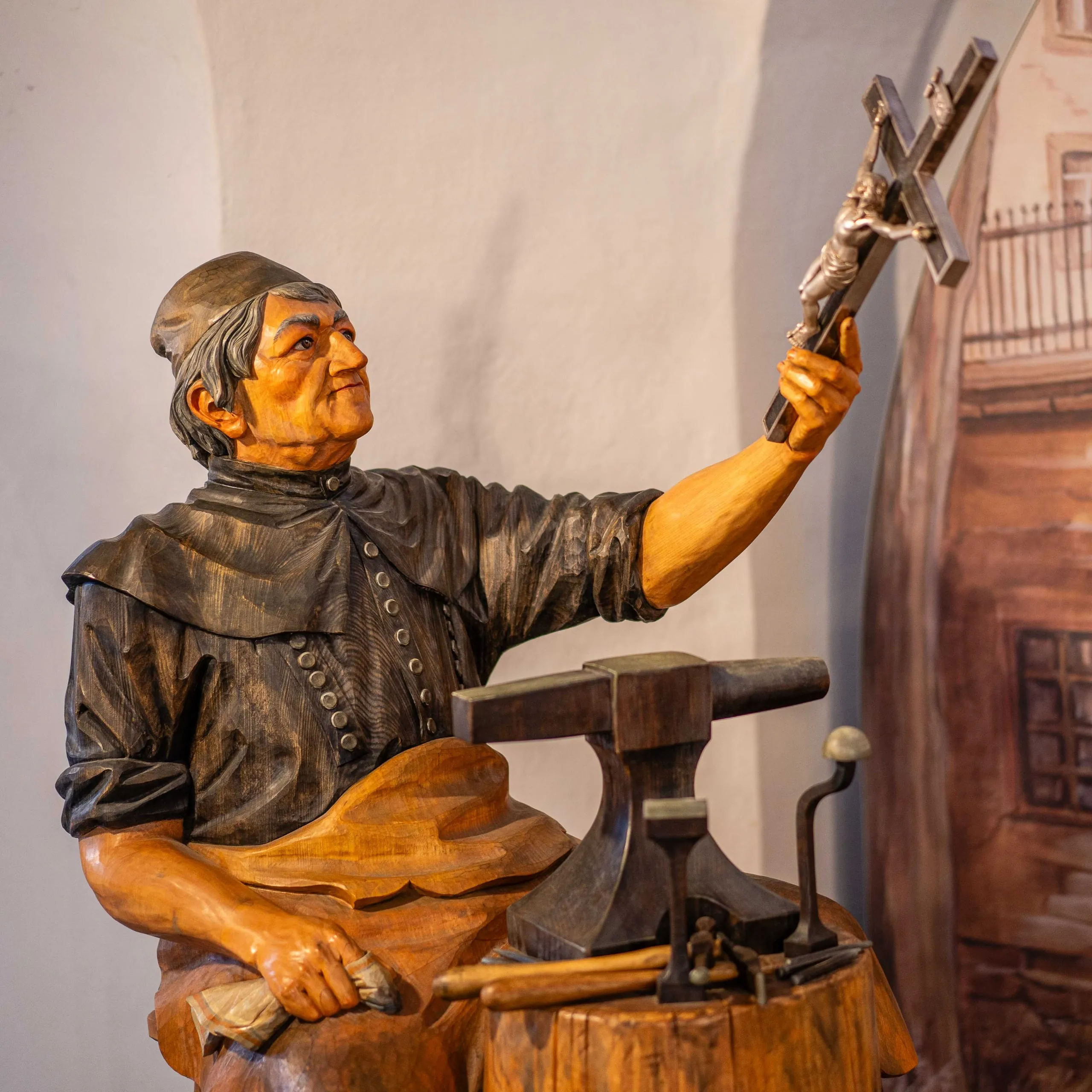 Bergschmied mit Kruzifix