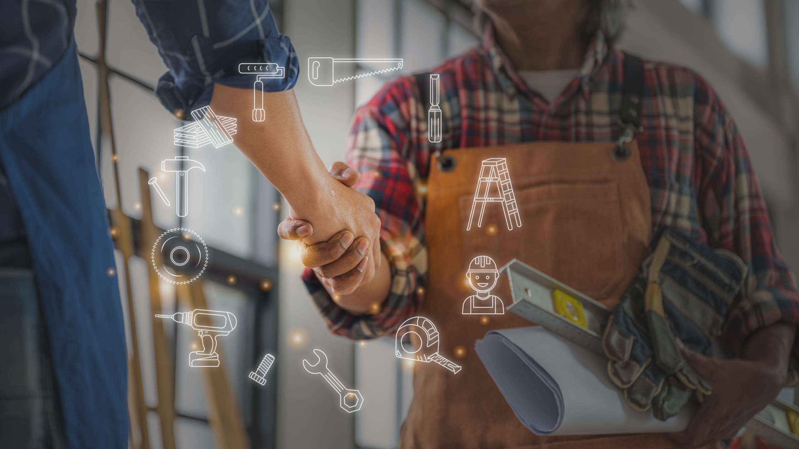 Lehrling und Meister geben sich die Hand